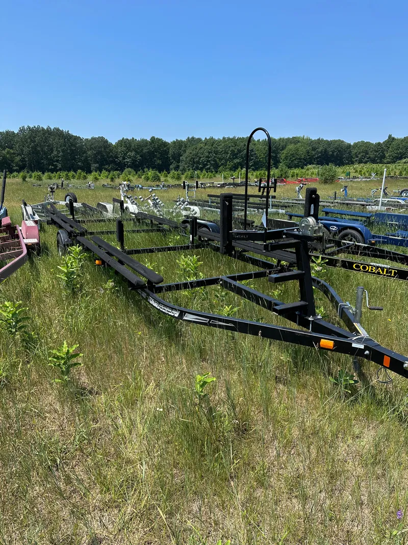 Slide: The Image of Trailer for 2012 Bennington 2275 GS in grassy field under clear blue sky. - 26
