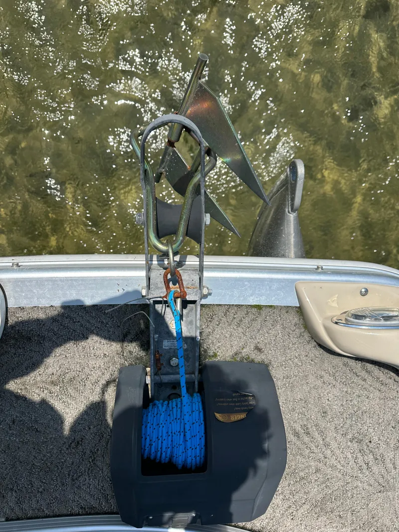 Slide: The Image of Anchor and winch system on 2012 Bennington 2275 GS boat, with blue rope and water background. - 8