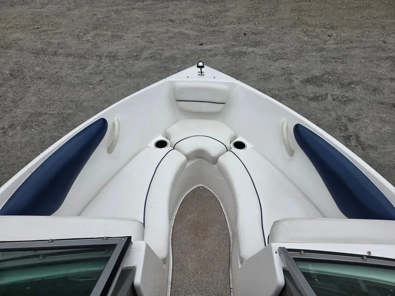 Slide: The Image of 2013 Rinker 186 Captiva boat interior with blue and white seating. - 9