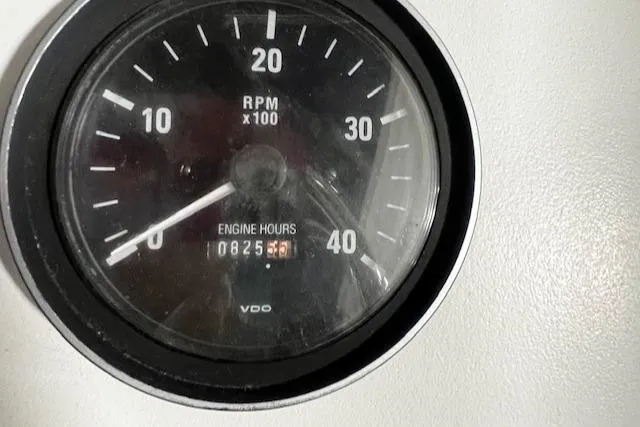 Slide: The Image of Tachometer showing 825.5 engine hours on 1999 Mainship Pilot 30 Softtop Cruiser. - 10