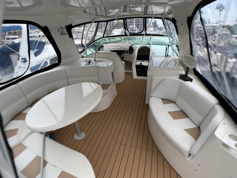 Slide: The Image of Interior of 2006 Carver 56 Voyager yacht with white seating and wooden flooring. - 20