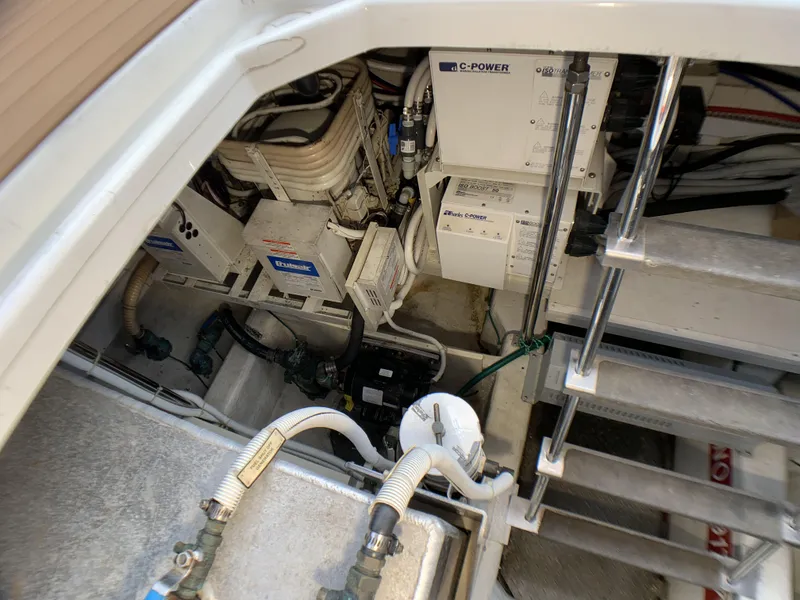 Slide: The Image of Engine room of a 2006 Carver 56 Voyager yacht showing mechanical equipment. - 25