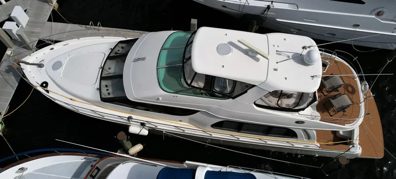 The Image of Top view of a 2006 Carver 56 Voyager yacht docked at a marina. - 0