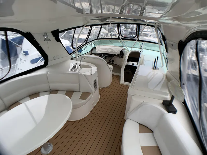 Slide: The Image of Interior of a 2006 Carver 56 Voyager yacht with luxurious seating and helm station. - 24