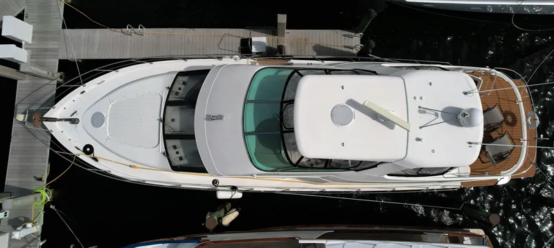 Slide: The Image of Top view of a 2006 Carver 56 Voyager yacht docked at a marina. - 3