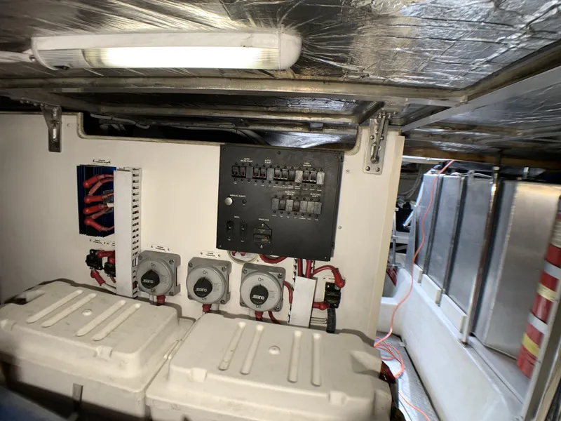 Slide: The Image of Electrical panel and battery compartment of a 2006 Carver 56 Voyager yacht. - 44