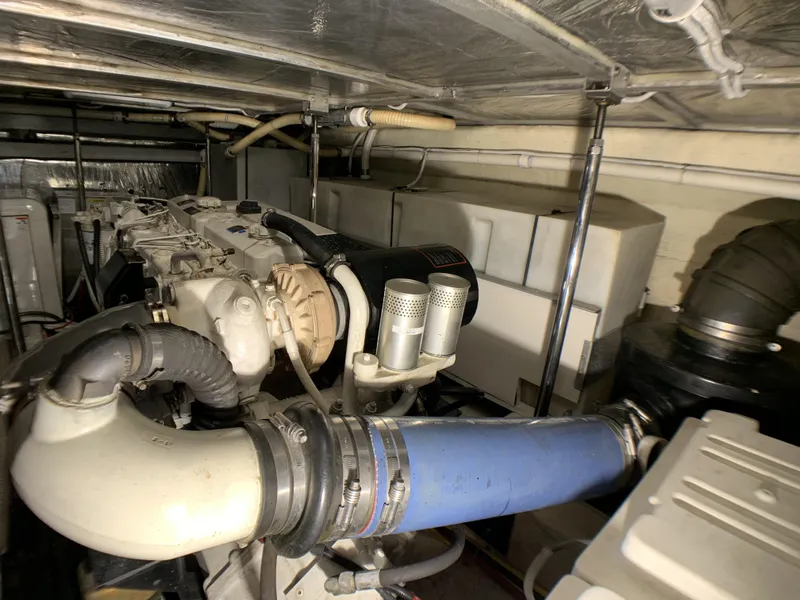Slide: The Image of Engine room of a 2006 Carver 56 Voyager yacht with visible components. - 46