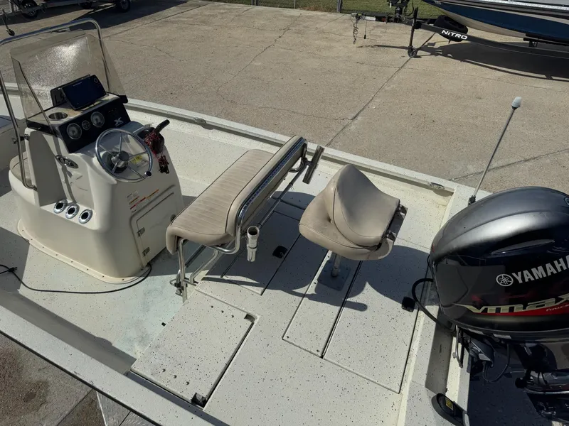 Slide: The Image of 2017 Xpress H20B boat interior with Yamaha VMAX engine, steering console, and seating. - 11