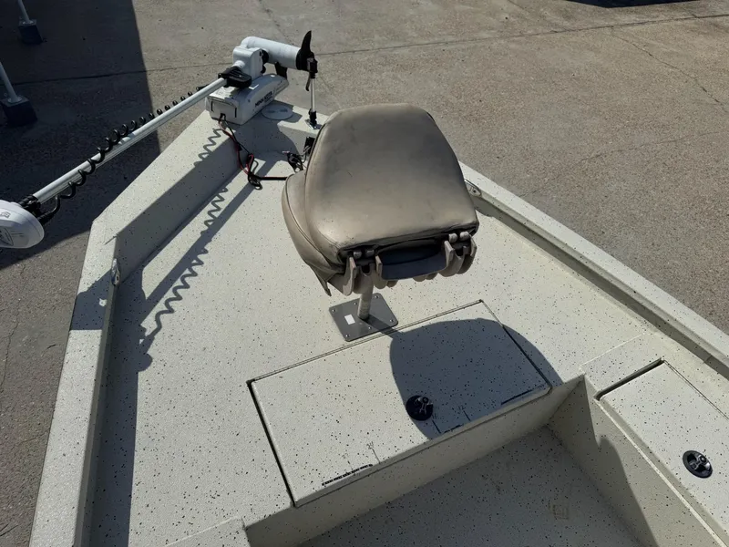 Slide: The Image of 2017 Xpress H20B boat with a trolling motor and swivel seat on a speckled deck. - 12