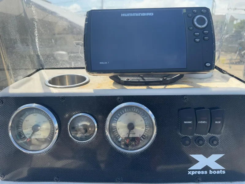 Slide: The Image of Dashboard of 2017 Xpress H20B boat with Humminbird Helix 7 GPS and gauges. - 16