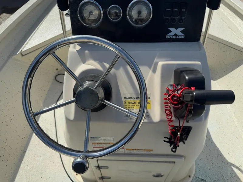 Slide: The Image of Steering console of 2017 Xpress H20B boat with gauges and controls. - 17