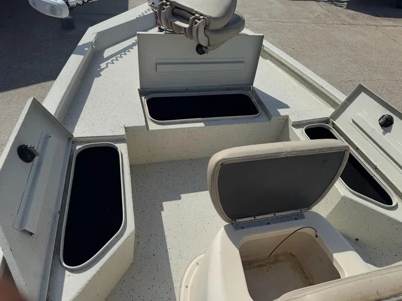 Slide: The Image of 2017 Xpress H20B boat interior with open storage compartments and seating. - 20