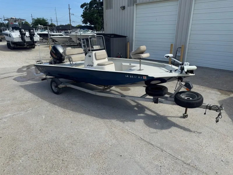 Slide: The Image of 2017 Xpress H20B boat on trailer, parked outside a storage facility. - 4