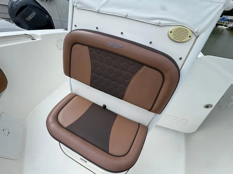 Slide: The Image of Brown and black cushioned seat on 2017 Tidewater 230 CC Adventure boat. - 14