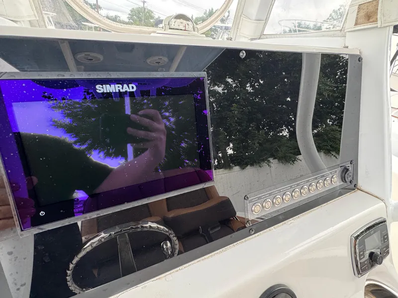Slide: The Image of Simrad display on 2017 Tidewater 230 CC Adventure boat dashboard. - 6