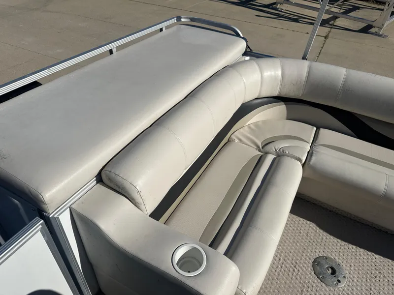 Slide: The Image of 2007 Crest 22 II LM boat interior with white leather seating and cup holder. - 13