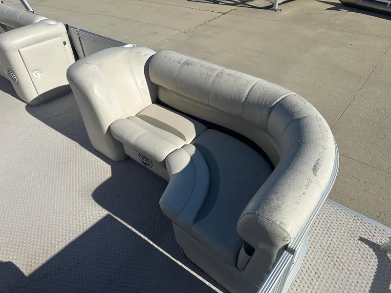 Slide: The Image of 2007 Crest 22 II LM pontoon boat with white cushioned seating on deck. - 3