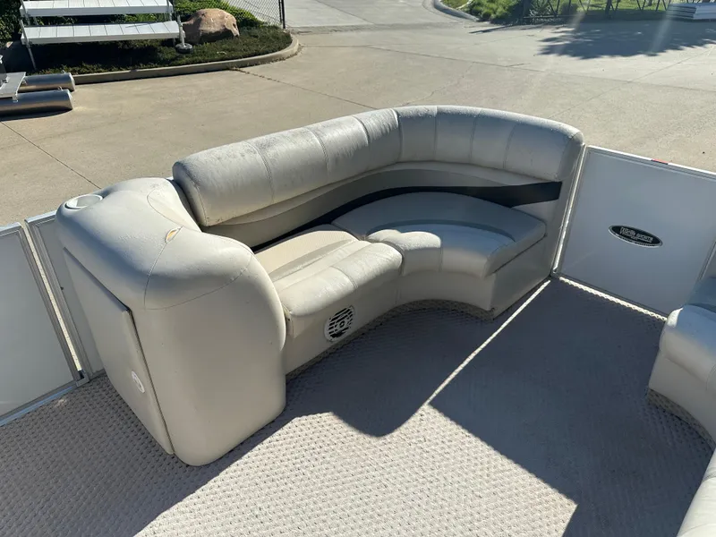 Slide: The Image of Luxurious seating on 2007 Crest 22 II LM pontoon boat, featuring plush, curved upholstery. - 6