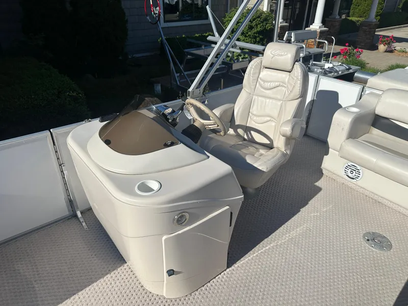 Slide: The Image of 2007 Crest 22 II LM boat interior with captain's chair and control console. - 9
