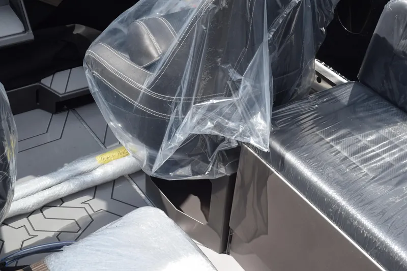 Slide: The Image of 2026 Stabicraft 2050 Treker Sportfish interior with seats wrapped in protective plastic. - 12