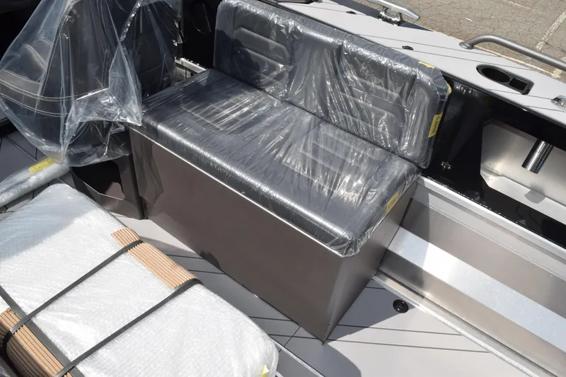 Slide: The Image of 2026 Stabicraft 2050 Treker Sportfish interior with plastic-covered seating and storage. - 13