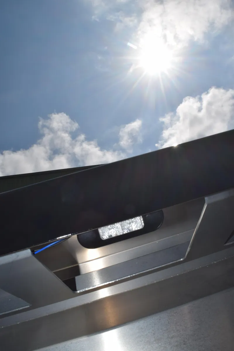 Slide: The Image of Sunlight shining on Stabicraft 2050 Treker Sportfish, 2026 model, with clear blue sky. - 18