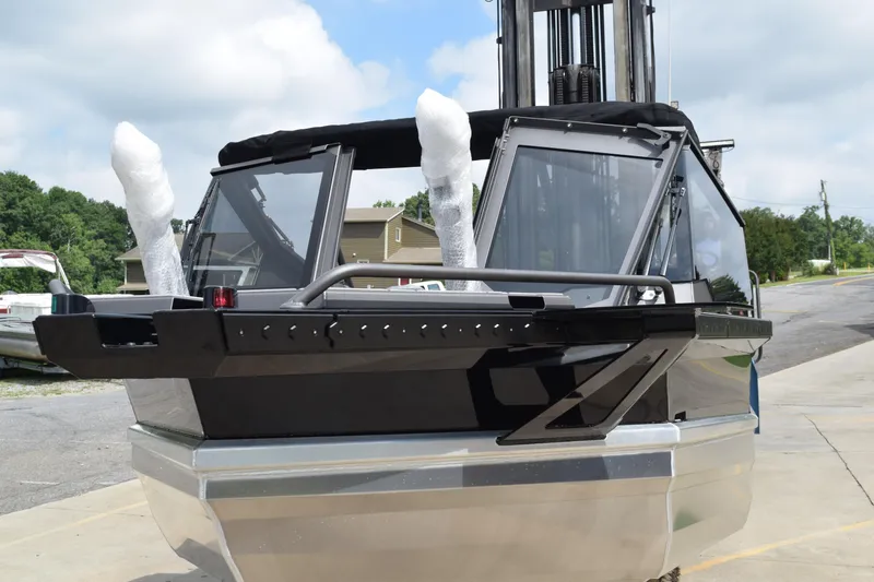 Slide: The Image of 2026 Stabicraft 2050 Treker Sportfish boat, black exterior, docked outdoors. - 3