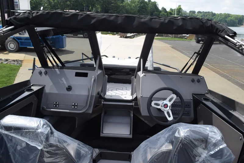 Slide: The Image of 2026 Stabicraft 2050 Treker Sportfish interior with dual consoles and steering wheel. - 7