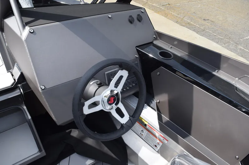 Slide: The Image of Stabicraft 2050 Treker Sportfish 2026 dashboard with steering wheel and controls. - 9