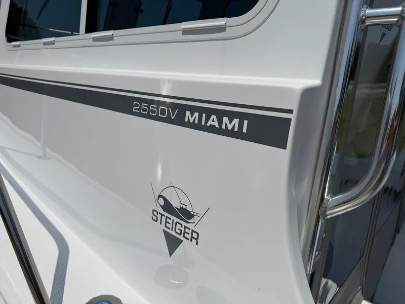 Slide: The Image of 2026 Steiger Craft 255 Miami boat exterior with logo and model name. - 14