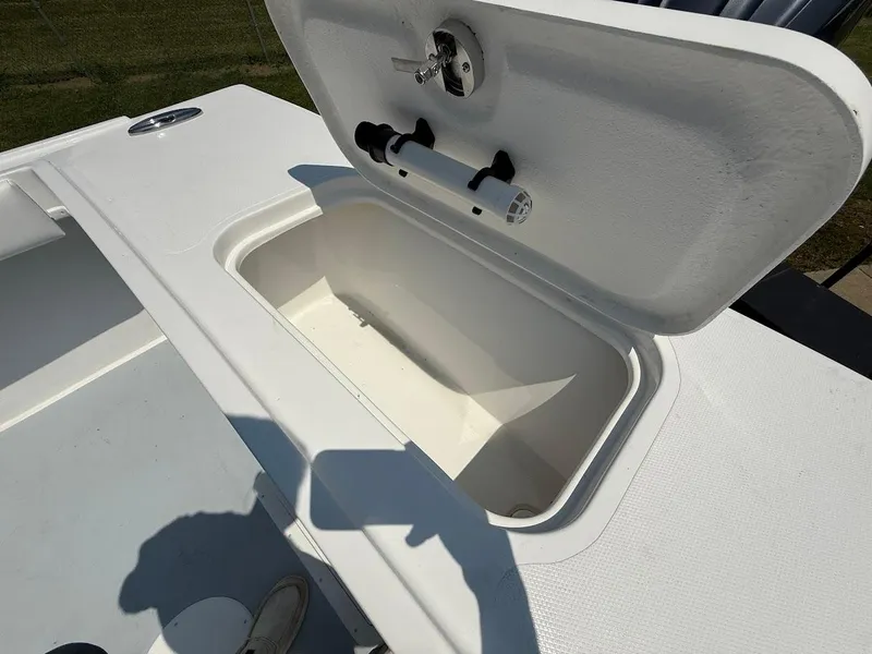 Slide: The Image of Open storage compartment on 2026 Steiger Craft 255 Miami boat deck. - 5