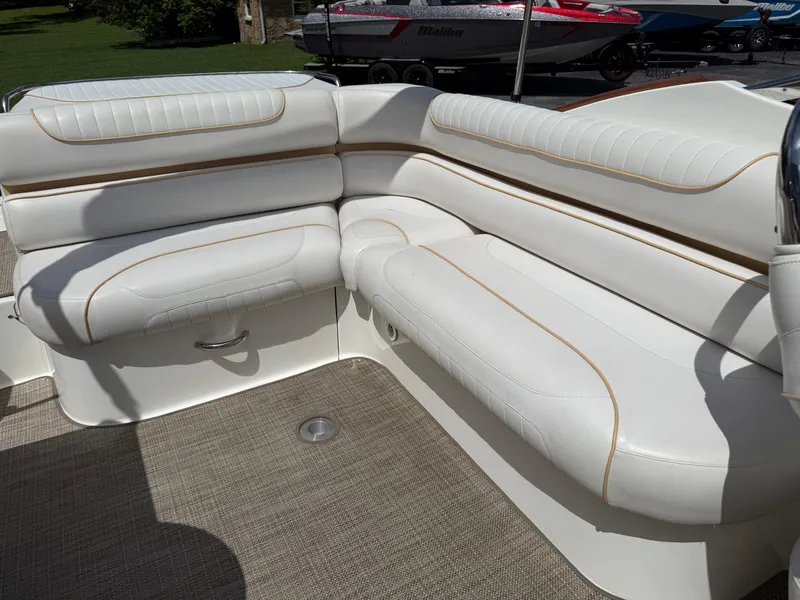Slide: The Image of 2008 Doral 265 Elite Bowrider interior with white cushioned seating. - 14