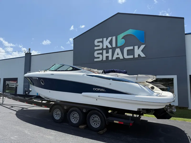 Slide: The Image of 2008 Doral 265 Elite Bowrider on trailer outside Ski Shack building. - 2
