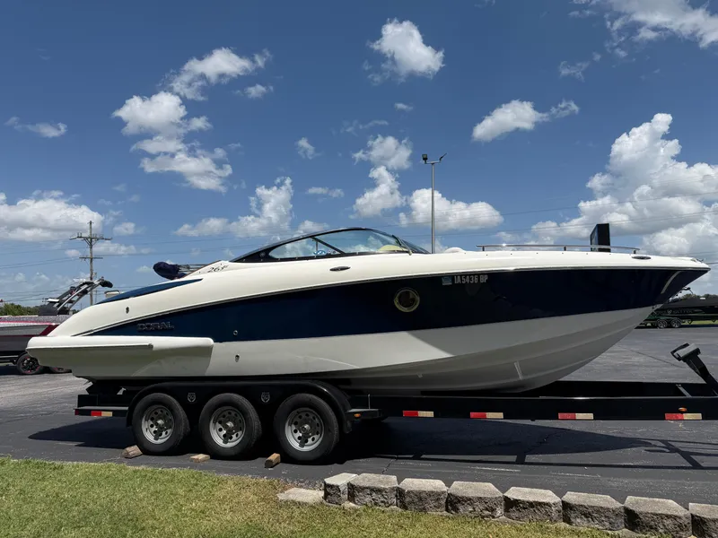 Slide: The Image of 2008 Doral 265 Elite Bowrider on trailer under clear blue sky. - 3