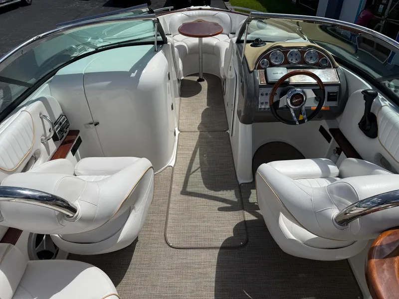 Slide: The Image of 2008 Doral 265 Elite Bowrider interior with white seating and modern dashboard. - 5