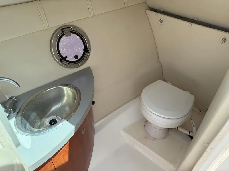 Slide: The Image of 2008 Doral 265 Elite Bowrider bathroom with sink and toilet. - 9