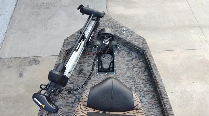 Slide: The Image of 2023 Xpress XP180 boat with trolling motor and camo pattern deck. - 3