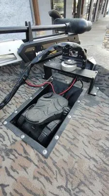Slide: The Image of 2023 Xpress XP180 boat with trolling motor and foot pedal on patterned deck. - 4