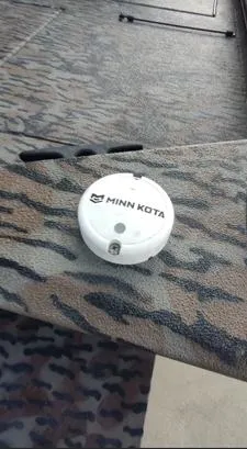 Slide: The Image of Minn Kota device on 2023 Xpress XP180 boat deck with camouflage pattern. - 7