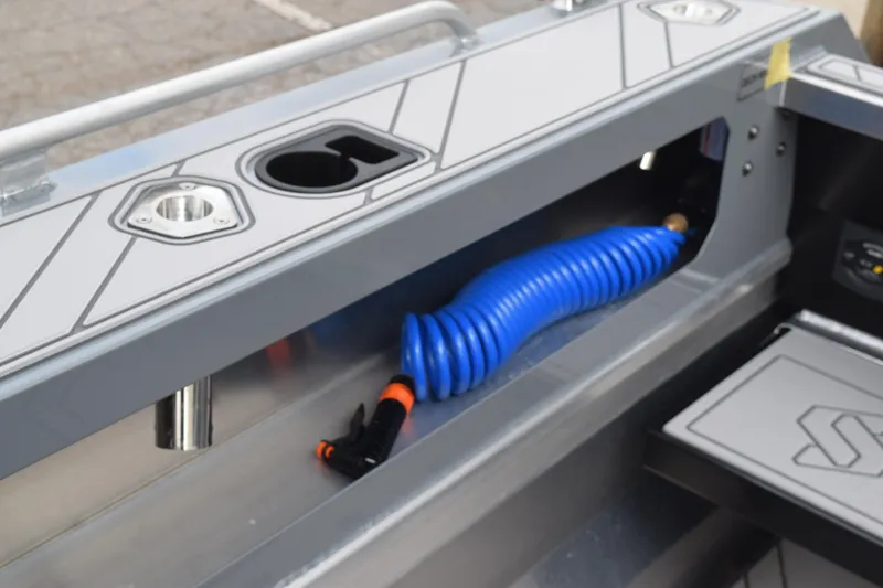 Slide: The Image of 2026 Stabicraft 2050 Supercab Sportfish interior detail with blue coiled hose and cup holder. - 12