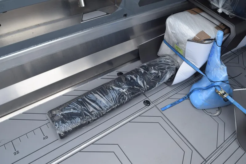 Slide: The Image of Interior of 2026 Stabicraft 2050 Supercab Sportfish with secured equipment and packaging. - 16