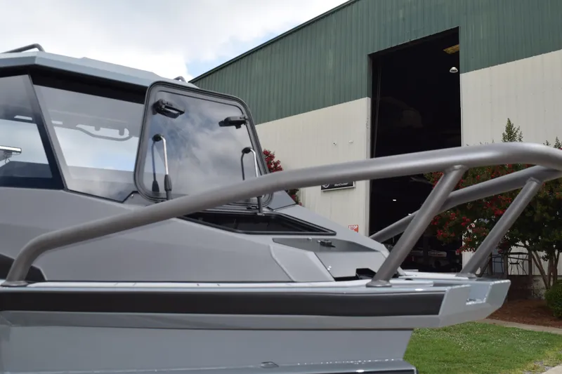 Slide: The Image of 2026 Stabicraft 2050 Supercab Sportfish boat near industrial building. - 4