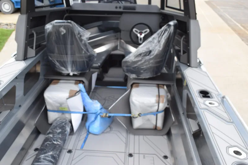 Slide: The Image of 2026 Stabicraft 2050 Supercab Sportfish interior with covered seats and secured equipment. - 7