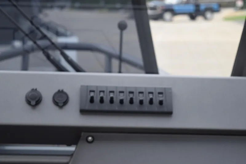 Slide: The Image of Control panel of 2026 Stabicraft 2050 Supercab Sportfish boat with switches and outlets. - 9