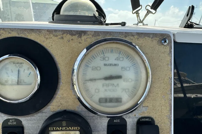 Slide: The Image of Dashboard of a 1996 Grady-White Spirit 175 boat with Suzuki RPM gauge. - 10