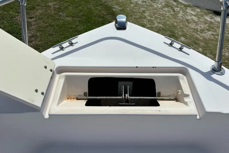 Slide: The Image of 1996 Grady-White Spirit 175 boat anchor compartment, open lid, stainless steel fittings. - 12
