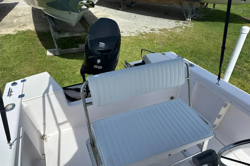 Slide: The Image of 1996 Grady-White Spirit 175 boat interior with Suzuki 90 outboard motor. - 18