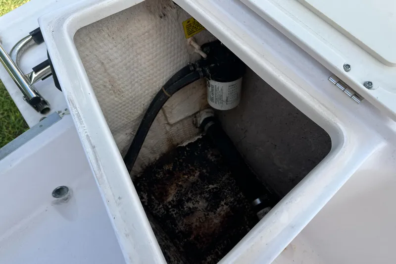 Slide: The Image of Storage compartment of a 1996 Grady-White Spirit 175 boat, showing interior details. - 25