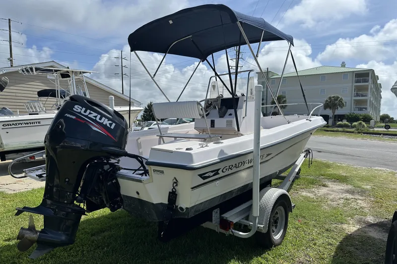 Slide: The Image of 1996 Grady-White Spirit 175 boat with Suzuki outboard motor on trailer. - 5