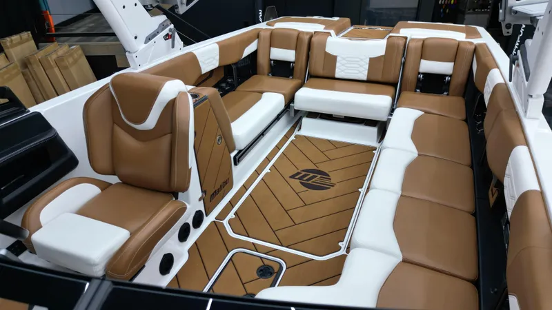 Slide: The Image of Luxurious interior of 2022 Malibu Wakesetter 25 LSV boat with brown and white seating. - 13